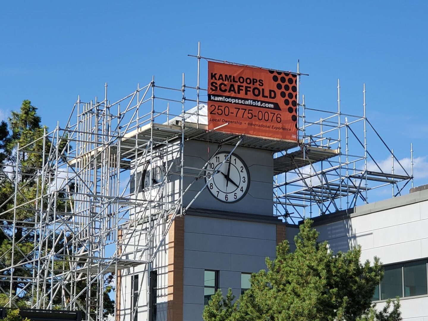 A clock tower with scaffolding around it.